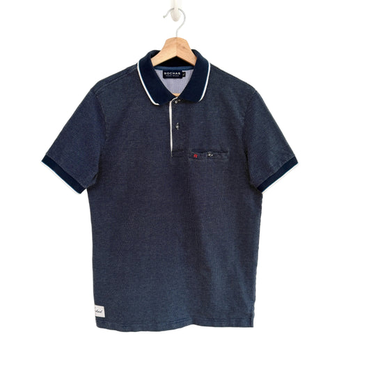 Navy blue polo shirt with white trim on a hanger against a white background