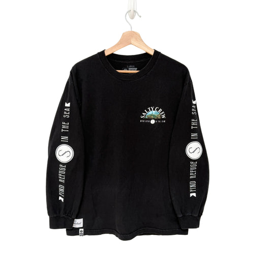 Black long-sleeve shirt with branding on a hanger against a white background