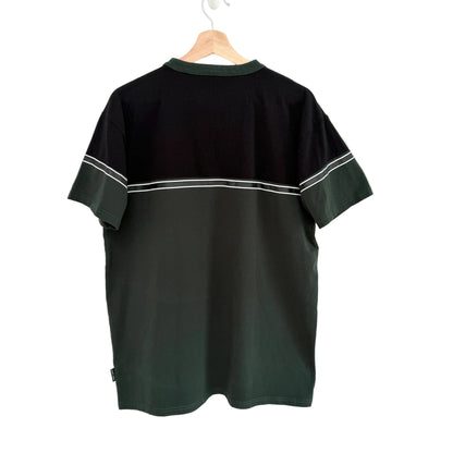 Black t-shirt with white trim on a hanger against a white background