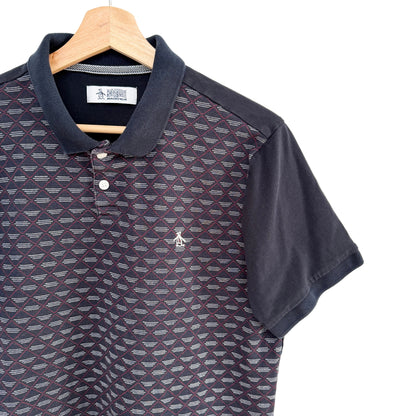 Patterned polo shirt on a hanger with a white background