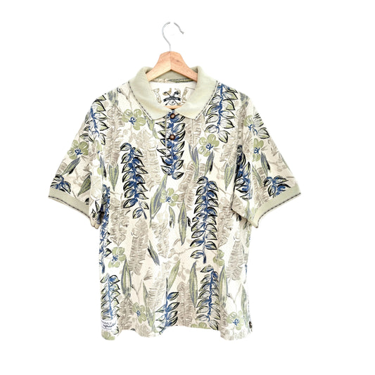 Floral patterned shirt on a hanger against a white background