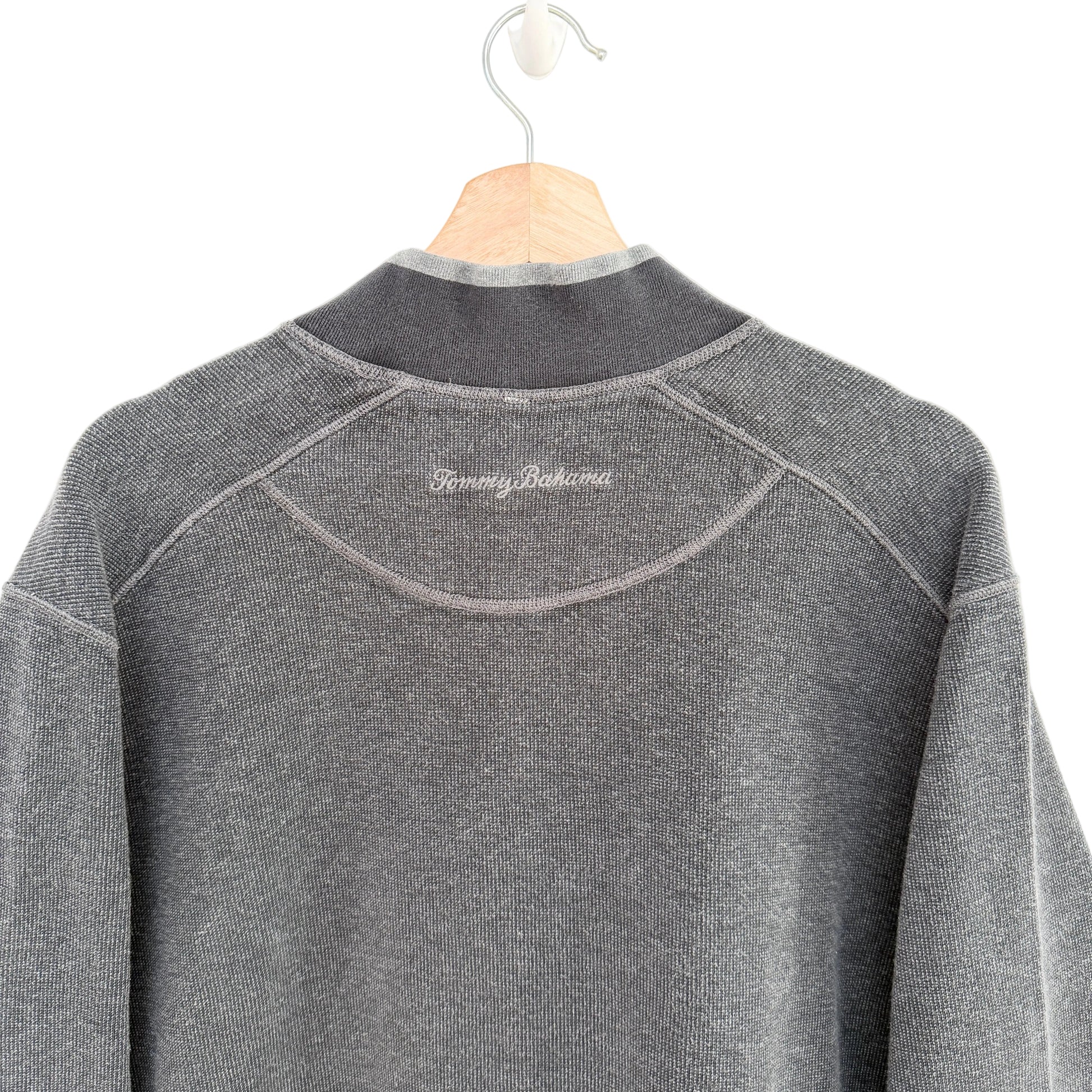 Gray fleece pullover on a hanger with 'Tommy Bahama' branding.