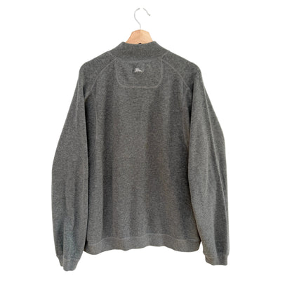 Gray fleece pullover on a hanger against a white background