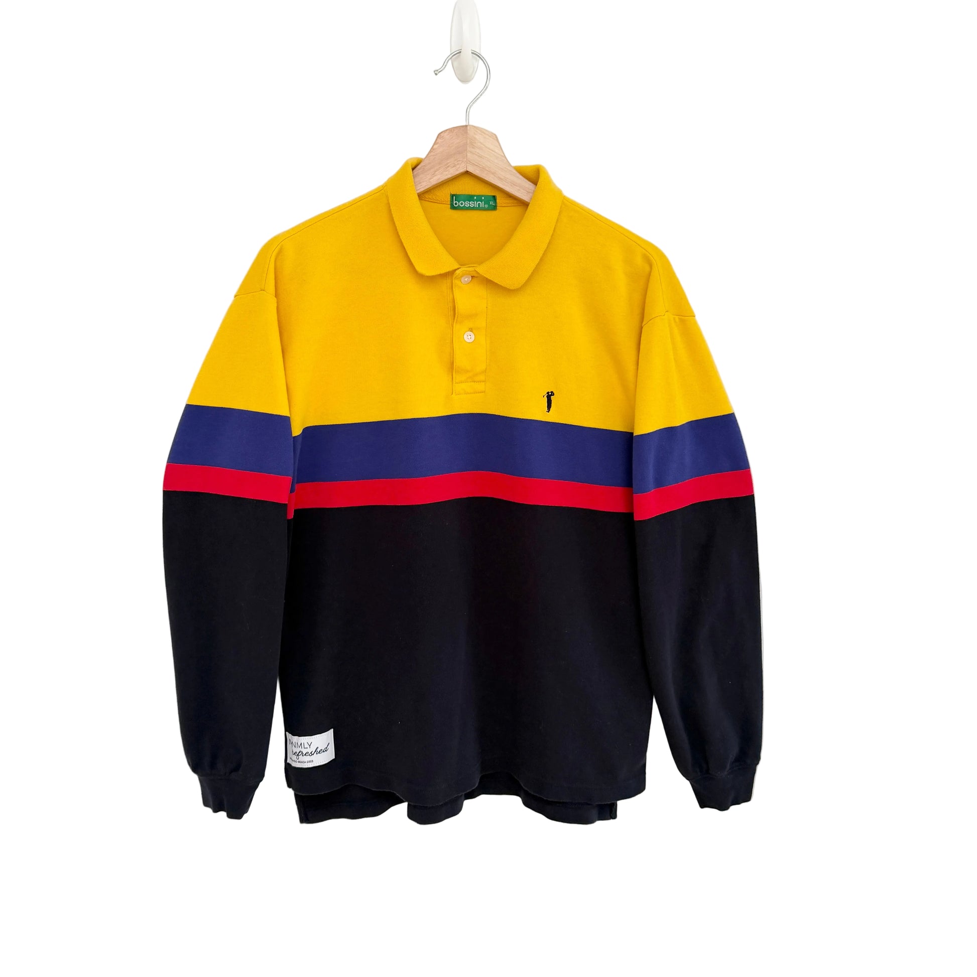 Color-blocked long-sleeve polo shirt with yellow, blue, and red stripes on a white background.