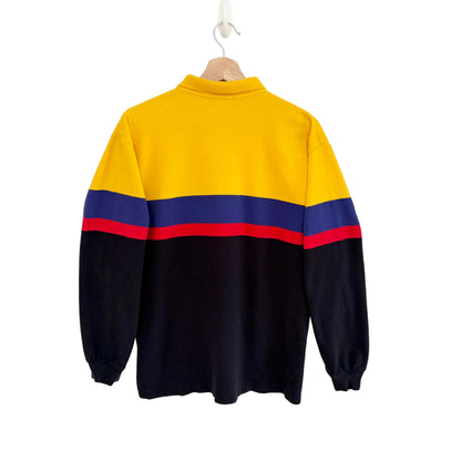 Colorful sweater with a yellow back, blue and red stripes on a white background