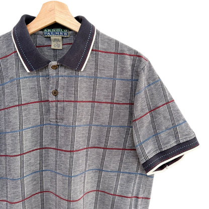Plaid polo shirt on a hanger with a visible brand label.