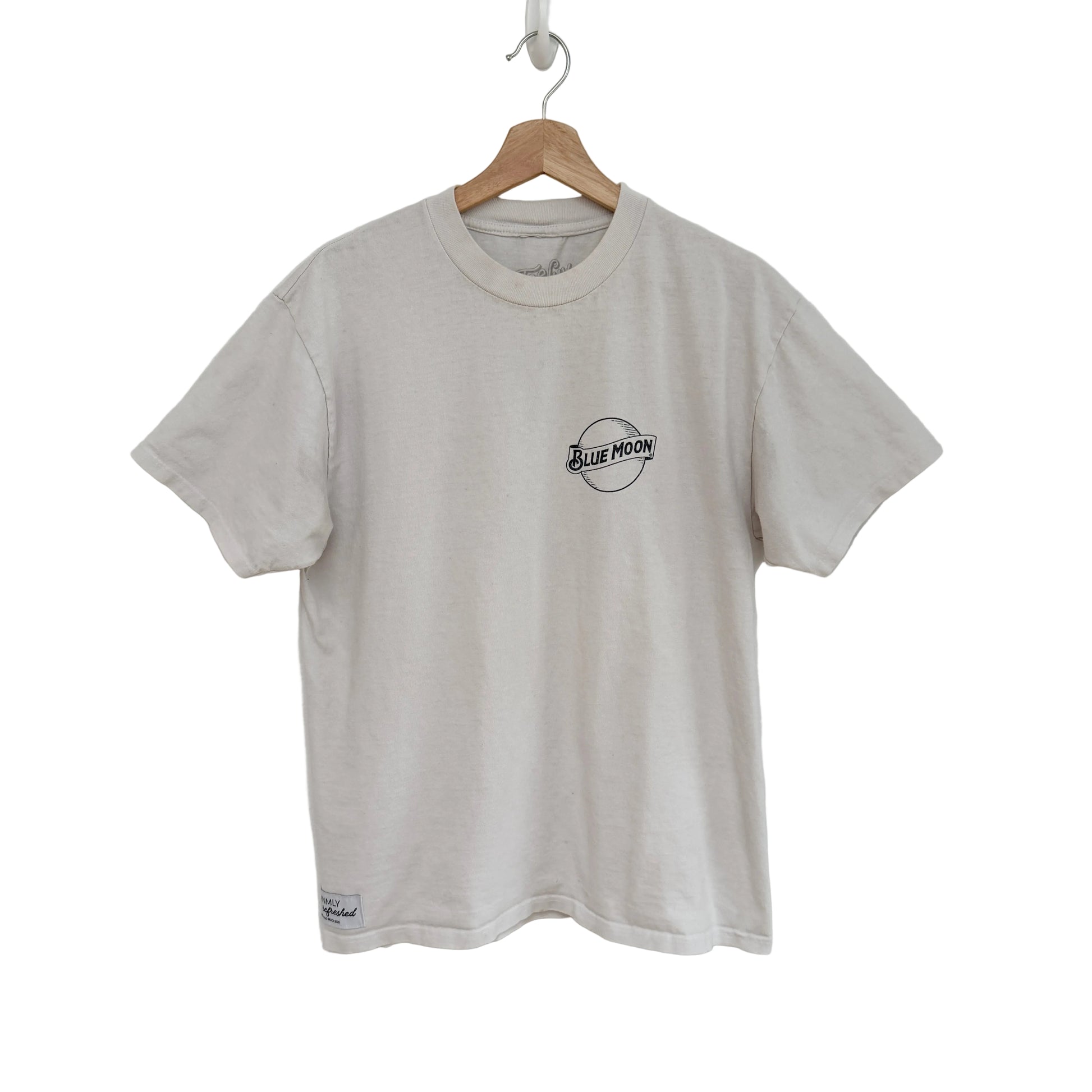 white t-shirt with a logo on a hanger against a white background