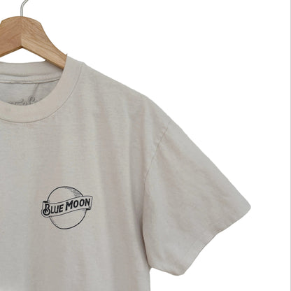 White t-shirt with 'Blue Moon' logo on a wooden hanger against a white background