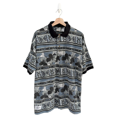 Patterned shirt on a hanger against a white background