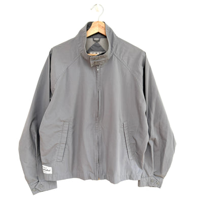 Gray jacket on a hanger against a white background