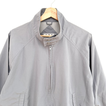 Gray jacket on a hanger against a white background