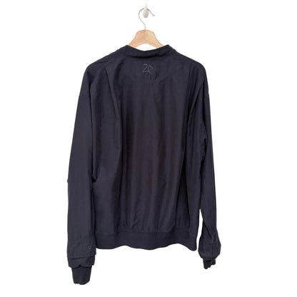 Navy blue long-sleeve shirt on a hanger against a white background