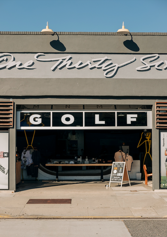 This is a photo of the front of MNML GOLF Club and event space; featuring a street view in Redondo Beach.